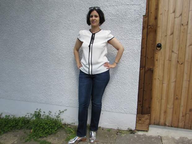 white top, blue jeans and metallic loafers white top, blue jeans and metallic loafers