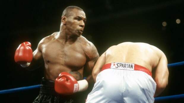 Mike Tyson throws a punch in the ring