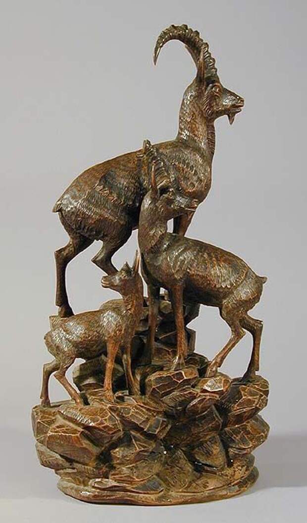 great carved wood ibex family on a rock, swiss 1900