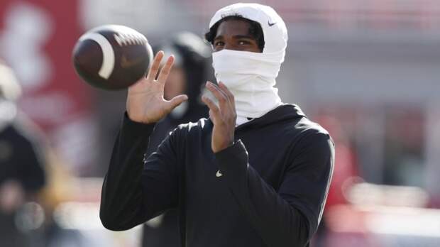 Shedeur Sanders warms up before a Colorado football game.