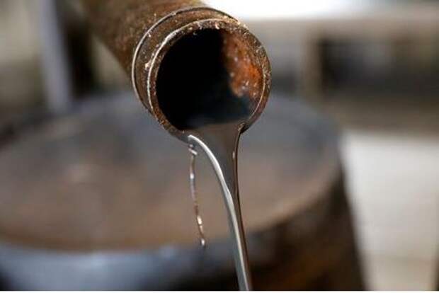 Oil pours out of a spout from Edwin Drake's original 1859 well that launched the modern petroleum industry at the Drake Well Museum and Park in Titusville, Pennsylvania U.S., October 5, 2017. REUTERS/Brendan McDermid