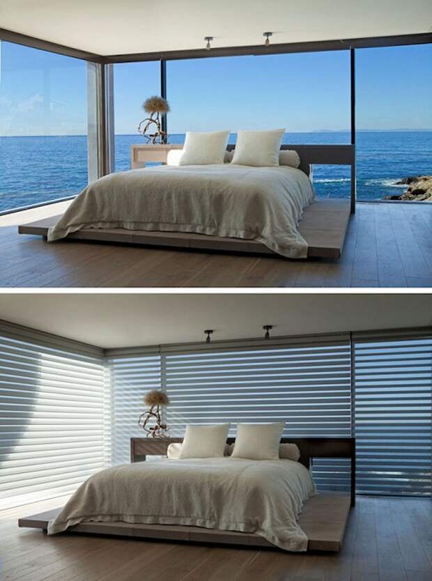 Отличный дизайн спальной с кроватью на деревянной платформе и шикарным видом.