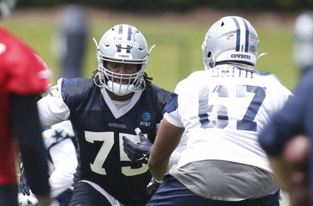 Jun 3, 2021; Frisco, TX, USA; Dallas Cowboys defensive tackle Osa Odighizuwa (75) goes through drills during voluntary Organized Team Activities at the Star Training Facility in Frisco, Texas. Mandatory Credit: Tim Heitman-USA TODAY Sports