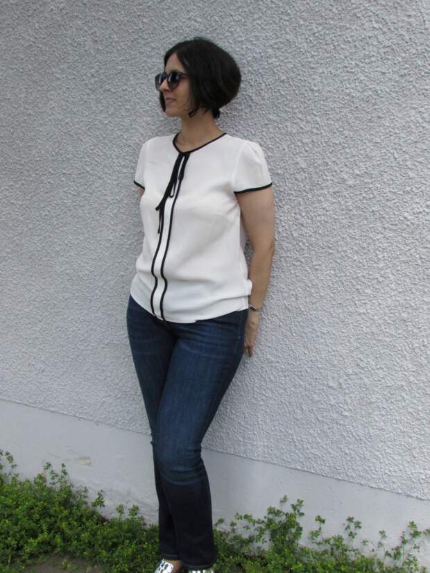 white top, blue jeans and metallic loafers white top, blue jeans and metallic loafers
