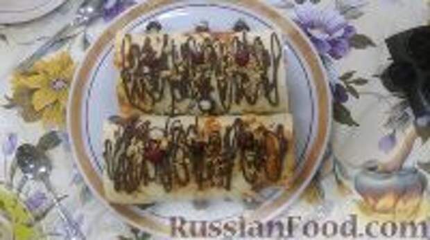 Фото к рецепту: Бисквитный рулет с бананами и вареньем Фото к рецепту: Бисквитный рулет с бананами и вареньем