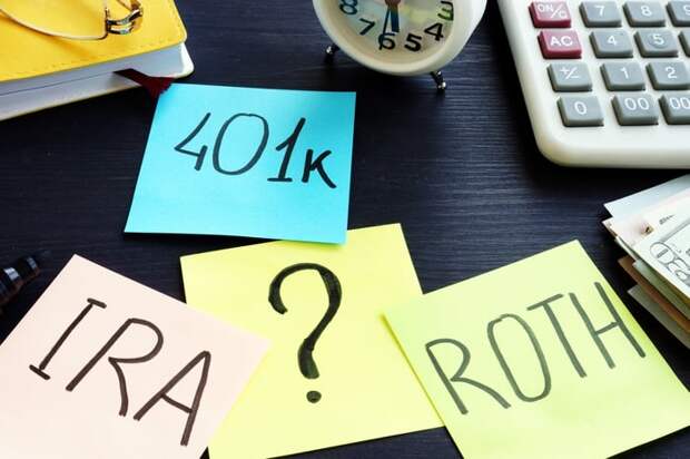 Four sticky notes with ?, 401k, IRA, and Roth written on them.
