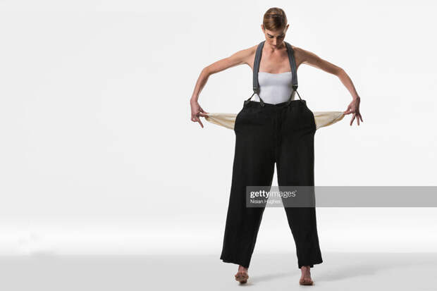 Woman Showing Empty Pockets Woman Showing Empty Pockets