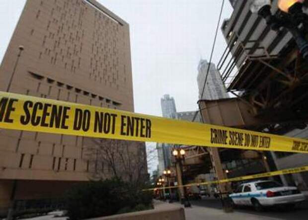 CHICAGO, IL - DECEMBER 18:  Crime scene tape surrounds the feder