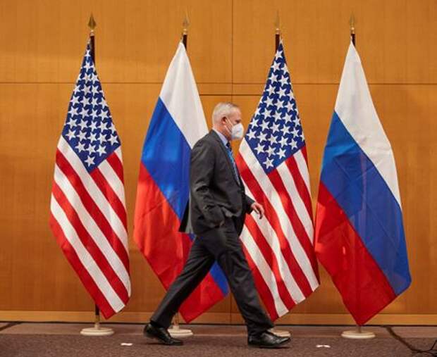 Russian and U.S. flags are pictured before talks between Russian Deputy Foreign Minister Sergei Ryabkov and U.S. Deputy Secretary of State Wendy Sherman at the United States Mission in Geneva, Switzerland January 10, 2022. REUTERS/Denis Balibouse 