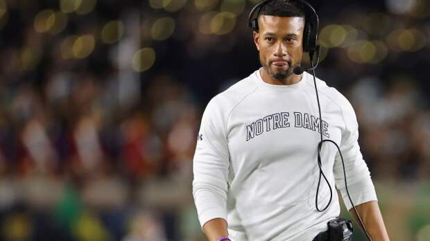Notre Dame coach Marcus Freeman walks the sidelines during a game against Ohio State.