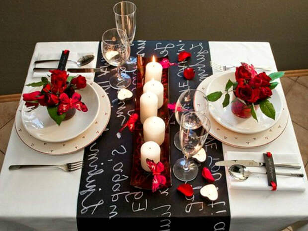 small-but-romantic-valentines-day-table-settings-with-candles-in-center-and-flower-above-the-plate