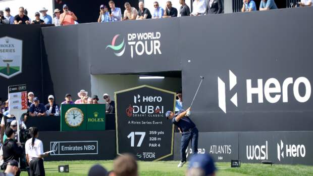 Patrick Reed tees off.