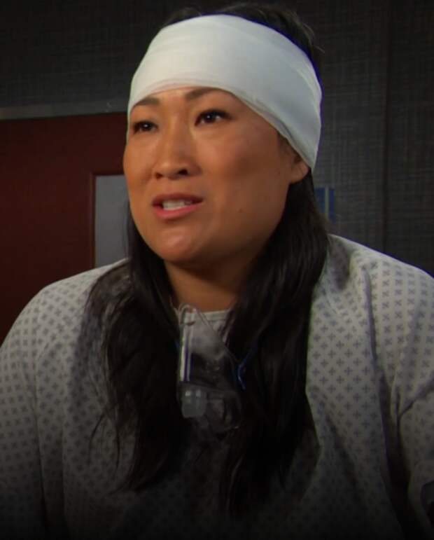 Melinda sits in a hospital room with a bandage around her head on Days of Our Lives