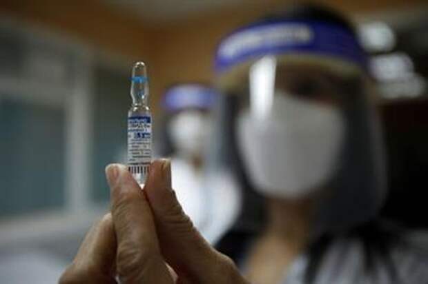 A healthcare worker shows an ampule with the Sputnik V coronavirus disease (COVID-19) vaccine in Podgorica, Montenegro, February 22, 2021. REUTERS/Stevo Vasiljevic