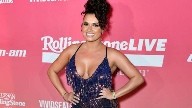 joy taylor in a blue dress
