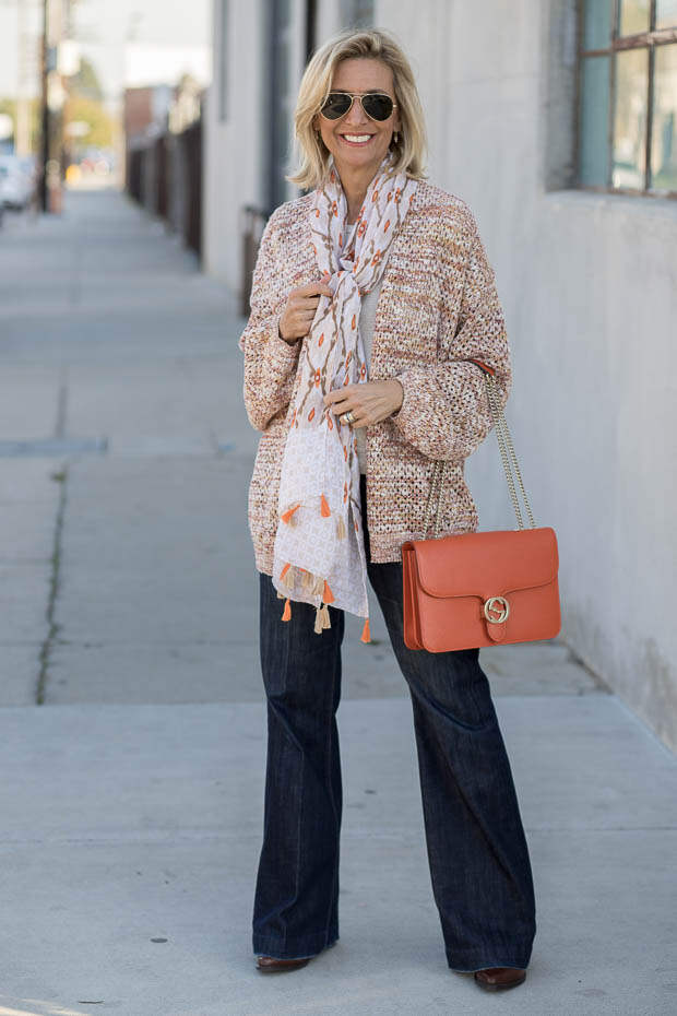 A spring look styled with a multi colored yarn womens cardigan and scarf