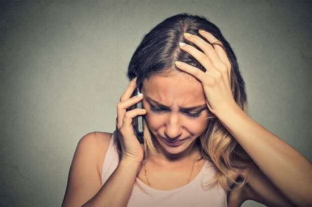 A distressed woman on the phone