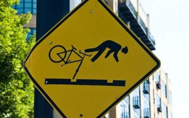 Дорожный знак "Падающий велосипедист"
