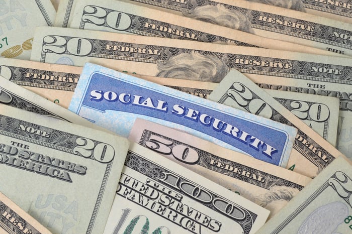 A Social Security card buried among $100 bills.