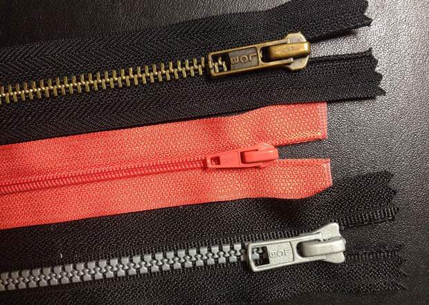 Zippers with common teeth variations: metal teeth (top), coil teeth and plastic teeth