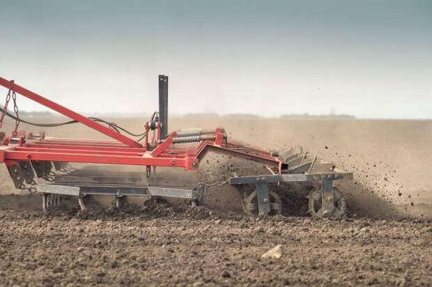 Tractor preparing land for sowing