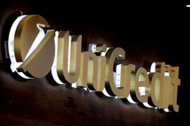 FILE PHOTO: The UniCredit bank logo in the old city centre of Siena, Italy, June 29, 2017. REUTERS/Stefano Rellandini/File Photo