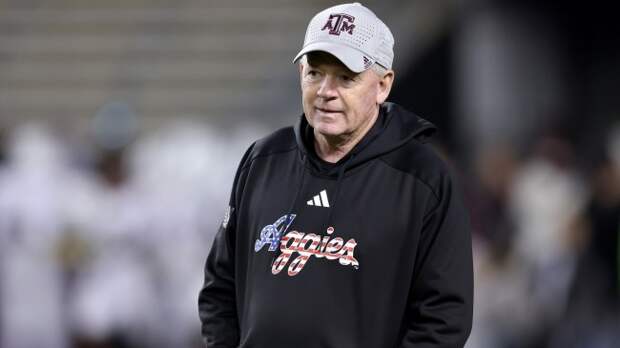 Bobby Petrino on the field before a Texas A&M game.