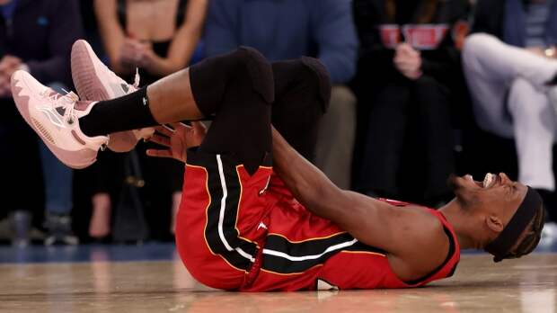 Jimmy Butler reacts after suffering an ankle injury