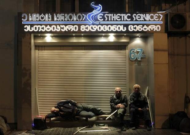 Activists rest during an overnight opposition rally in Tbilisi