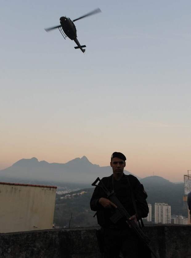A police helicopter overflies Rio de Jan