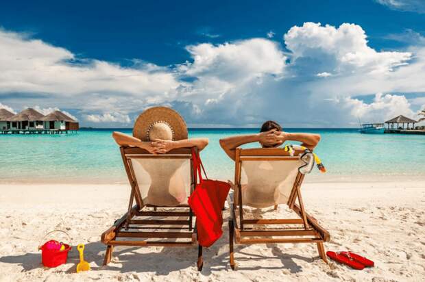 man and woman in beach chairs.png