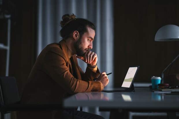 Person looking at laptop.