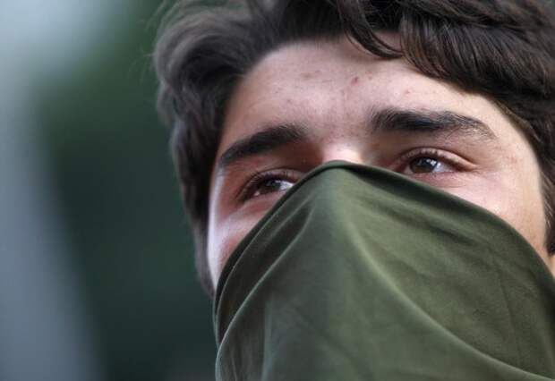 A man listens during an opposition rally in Tbilisi