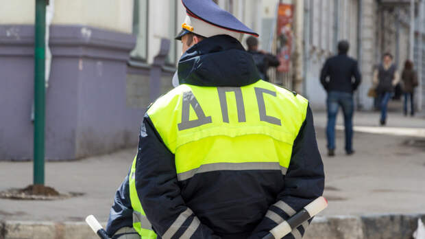 Russian police officers standing by the road in lime-colored uniform
