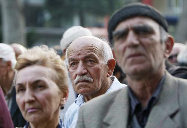 People listen during an opposition rally in Tbilisi