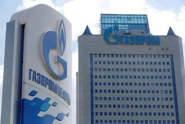 A board with the logo of Gazprom Neft oil company is seen at a fuel station in Moscow, Russia, May 30, 2016. REUTERS/Maxim Zmeyev/File Photo 