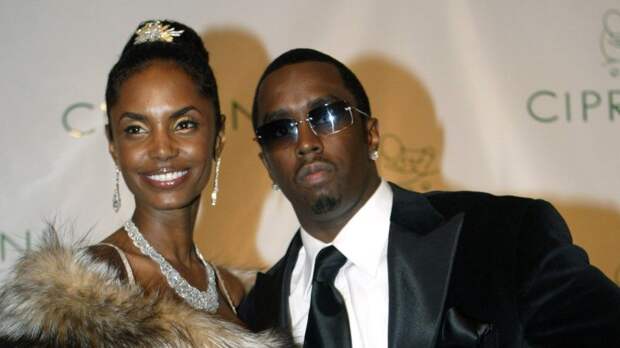Kim Porter and Sean 'Diddy' Combs at Combs' 35th birthday celebration in New York in 2004. Porter was found dead Thursday at her Los Angeles home. Kathy Willens / AP file