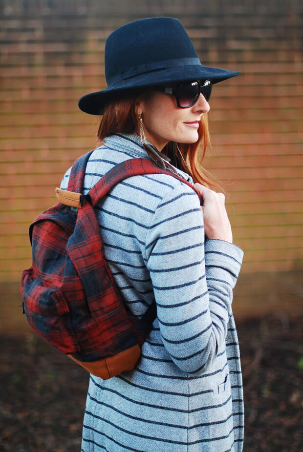 Striped longline blazer with black boots, plaid rucksack and fedora