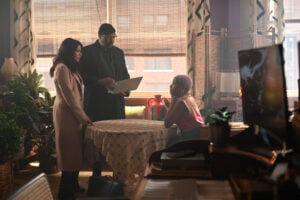 Alec and Rose holding a computer in front of Kylie on The Irrational Season 2 Episode 7