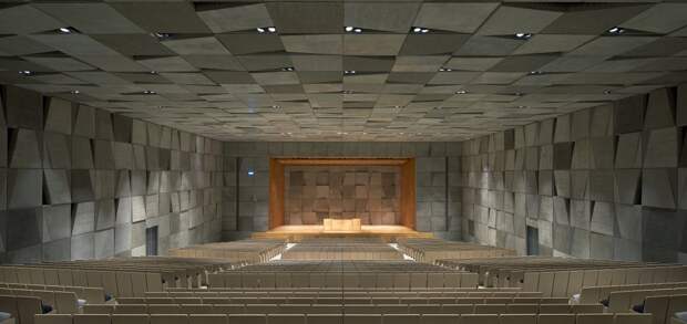 the-motif-even-penetrates-the-auditorium-which-has-paneled-gray-walls-and-black-and-white-seats