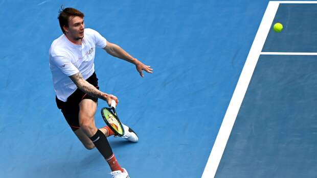 Alexander Bublik returns a serve.