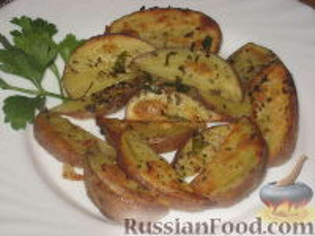 Фото к рецепту: Пряный печеный дольками картофель