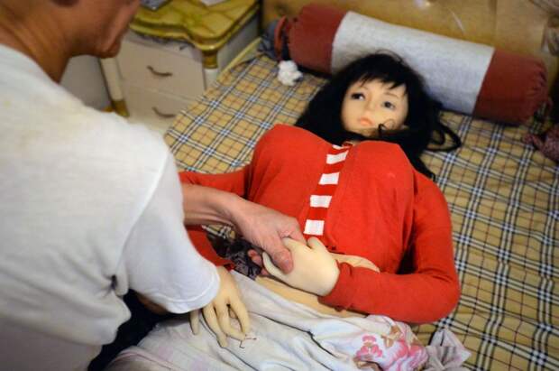 Man lives with sex doll to remember his deceased wife, Chongzhou city, Sichuan province, China - 18 Aug 2016
