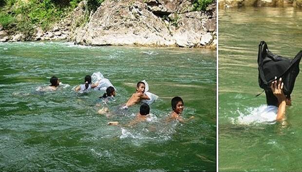 Чтобы попасть в школу детям, надо вплавь преодолеть реку. Чтобы попасть в школу детям, надо вплавь преодолеть реку.