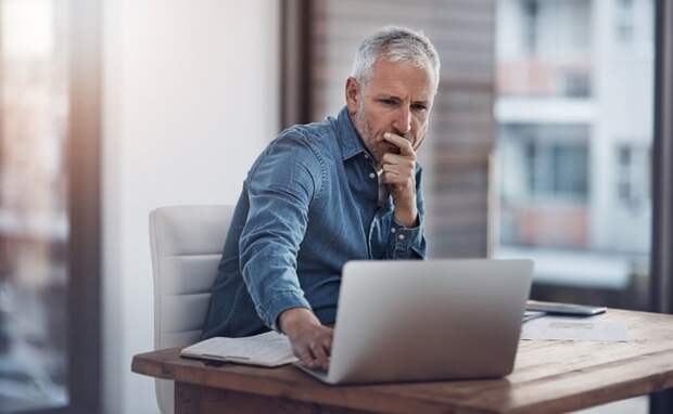 A person at a laptop.