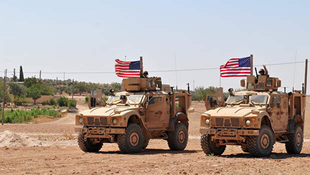 Американские военнослужащие в районе населенного пункта Манбидж, Сирия. 28 июля 2018