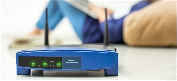 Wireless router and kids using a laptop in home