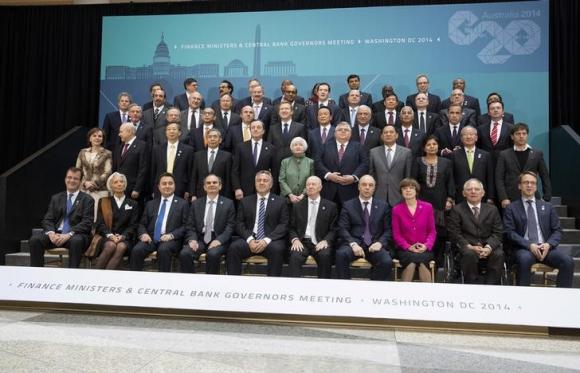 G20 Finance Ministers and central bankers pose for the family portrait during the IMF/World Bank 2014 Spring Meeting in Washington April 11, 2014. REUTERS/Joshua Roberts