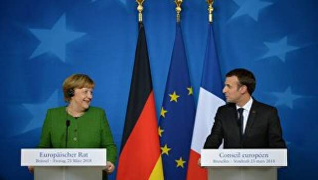 Канцлер Германии Ангела Меркель и президент Франции Эммануэль Макрон на саммите ЕС в Брюсселе. 23 марта 2018