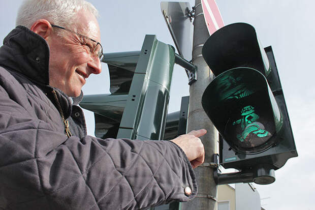 The mayor of Trier poses for a photograph with the new lights.